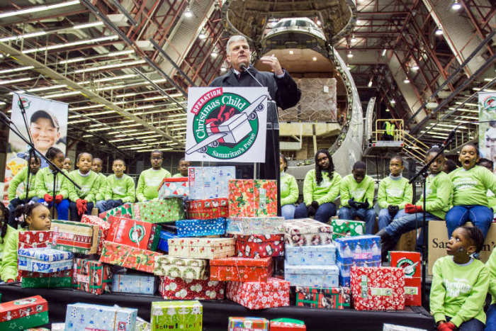 Operation Christmas Child, the annual holiday outreach event organized by Franklin Graham's Samaritan's Purse, shipped off more than 60,000 shoe boxes for young survivors of Typhoon Haiyan in the Philippines on Thursday, Dec. 12, 2013, at JFK Airport's Hangar 19 in New York City. Here, Graham addresses attendees.