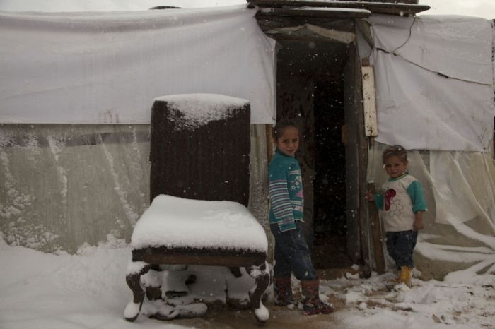Hiam (age 5, on the left) and her sister Asma (age 3, on the right). In the Bekaa, one of the coldest areas of Lebanon, it is a critical time for many Syrian refugees living in tents or housing that are flimsy or without heating, leaving them especially vulnerable to the cold. World Vision started working with partners to provide unconditional cash assistance of $550 to 25,000 families over a five-month period. This money covers the cost of stove, and fuel plus providing them with 5 blankets. 'Without the stove, my legs would freeze and my little sister would cry,' said Hiam.