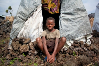 Innocent, 11, was orphaned during the war. Rebels entered his family's village and they were forced to flee - his parents over the border to Rwanda and Innocent into the Congolese wilderness. He later discovered his parents died, and today he lives alone in the Mugunga 1 IDP camp in Goma, Democratic Republic of Congo. He spends his days combing the forest in search of food, hoping to somehow return home.