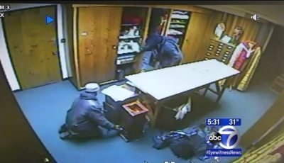 Surveillance footage shows two men breaking into the New York City-based St. John the Baptist Church and stealing from its poor boxes on Dec. 26. 2013.
