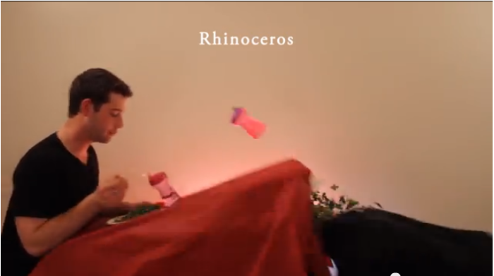 In 'How Animals Eat Their Food, Christian college students Ian Deibert and Nick Sjolinder act out animals in the act of consumption. Here, Sjolinder plays a rhinoceros and Deibert a confused bystander.