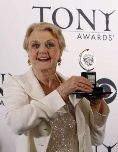 Actress Angela Lansbury poses with her Tony for best performance by a featured actress in a play for her role in 'Blithe Spirit' at the 63rd annual Tony Awards ceremony in New York, June 7, 2009.