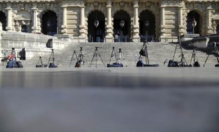Reporters' tripods are left in position in front of Italy's supreme court building in Rome July 31, 2013.