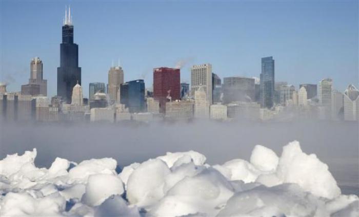 The Chicago skyline is seen beyond the arctic sea smoke rising off Lake Michigan in Chicago, Illinois, January 6, 2014.