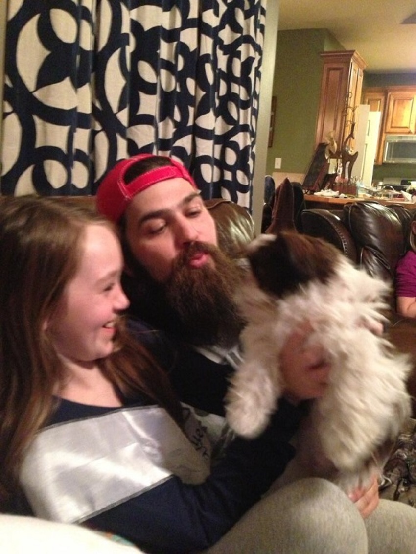 Jep Robertson and his daughter Lily of "Duck Dynasty" play with their new pup Gizmo.