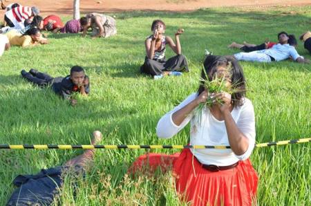 Members of Rabboni Centre Ministries in South Africa eat grass at the behest of Pastor Lesego Daniel.
