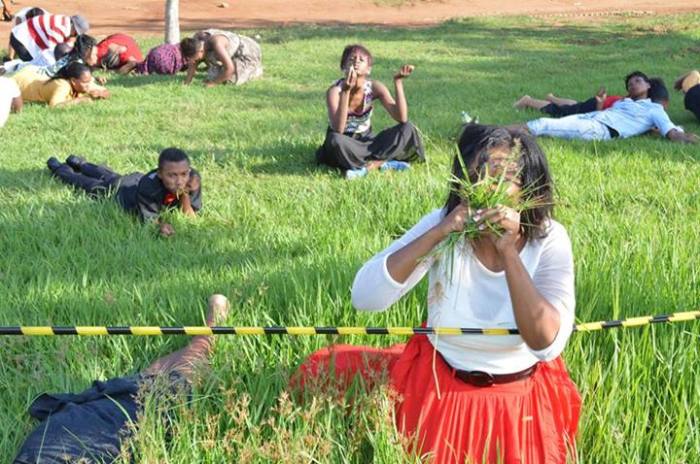 Members of Rabboni Centre Ministries in South Africa eat grass at the behest of Pastor Lesego Daniel.