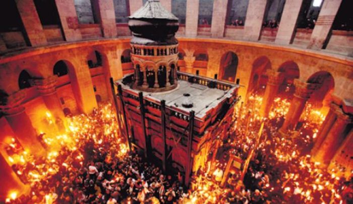 Worshipers thronging the Church of the Holy Sepulchre during the Christian Orthodox Holy Fire ceremony in Jerusalem last year.