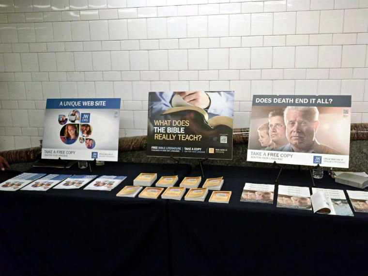 A table displaying Jehovah Witnesses literature is seen in this photo taken on Friday, Jan. 10, 2014, inside the Atlantic Terminal subway station in New York City.