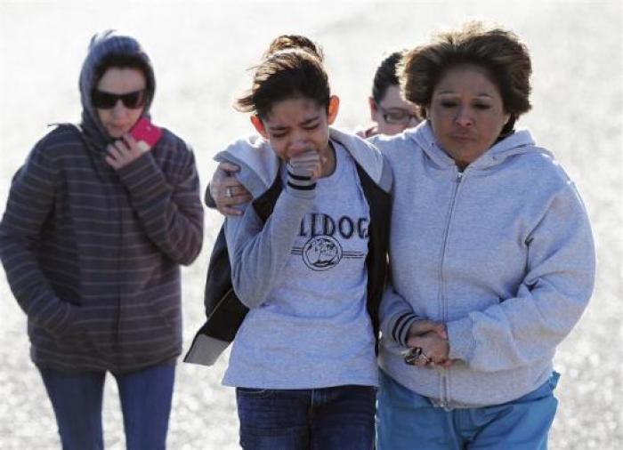 Students are reunited with families following an early morning shooting at Berrendo Middle School in Roswell, New Mexico, January 14, 2014.