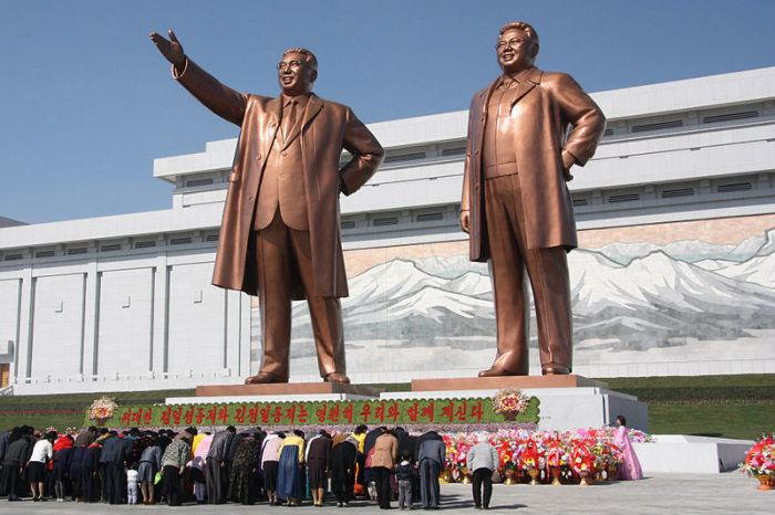 North Koreans bow before the statues of Kim Il-sung (left) and Kim Jong-il on Mansu Hill in the capital of Pyongyang in this 2012 photo.