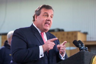New Jersey Governor Chris Christie speaks to media and homeowners about the ongoing recovery from Hurricane Sandy in Manahawkin, New Jersey January 16, 2014.