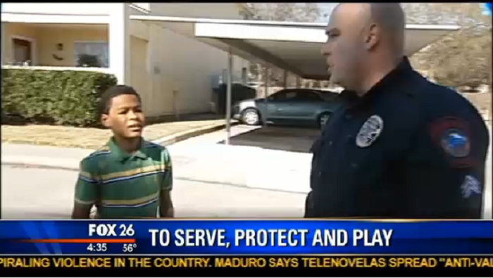 Jermaine Ford, 10, and Sgt. Ariel Soltura of the Rosenberg Police Department.