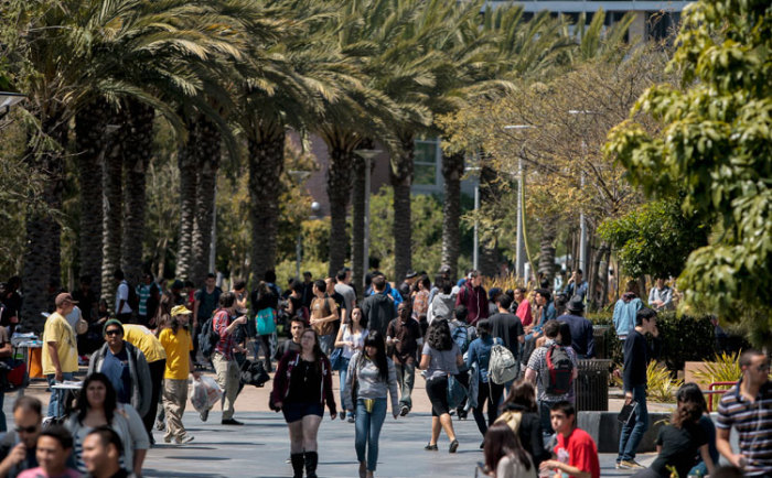 Students walk through campus between classes at Santa Monica College in Santa Monica, California April 4, 2012.