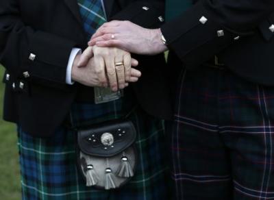 Larry Lamont and Jerry Slater (R) take part in a symbolic same-sex marriage outside the Scottish Parliament in Edinburgh, Scotland February 4, 2014.