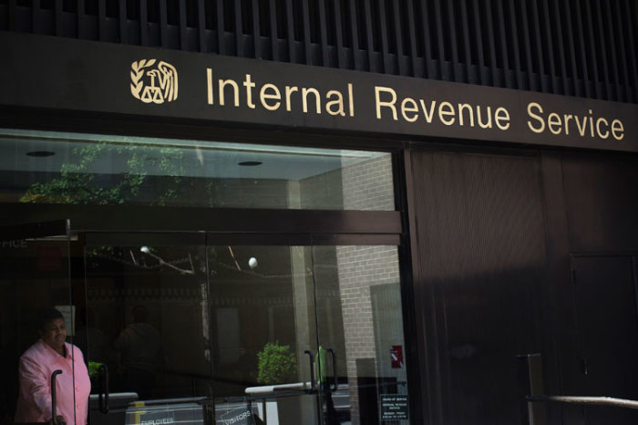 A woman walks out of the Internal Revenue Service building in New York in this May 13, 2013 photo.