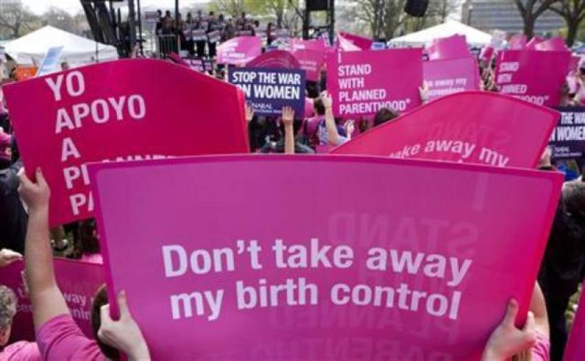 Members of Planned Parenthood, NARAL Pro-Choice America and more than 20 other organizations hold a 