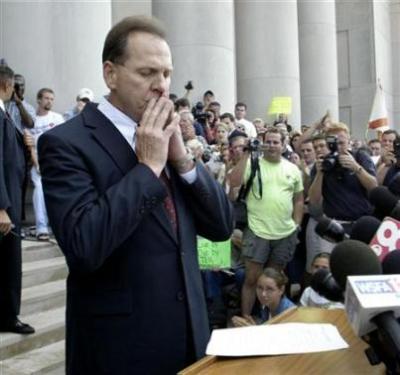 Alabama Superior Court Justice Roy Moore pauses before addressing his supporters outside the Alabama Judicial Building where a monument of the Ten Commandments was put in place by Moore and in which he has refused to take down, August 21, 2003 in Montgomery, Alabama.