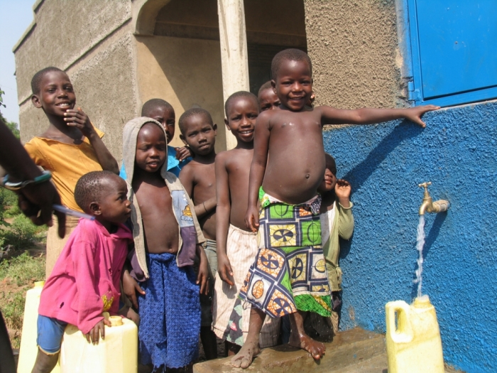 Uganda children at a water tap in this undated photo.