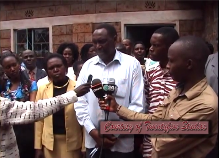 Pastor Anthony Maina (center) of the Assemblies of God Church in Embu, Kenya, apologizes for cheating on his wife Beth (left of him) to whom he has been married for 24 years. He was caught on camera with the wife of one of his congregants.