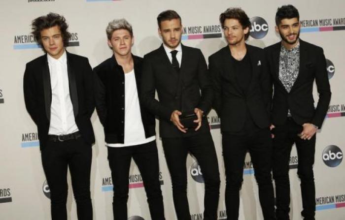 British boy band One Direction pose on the red carpet. From left to right: Harry Styles, Niall Horan, Liam Payne, Louis Tomlinson and Zayn Malik.
