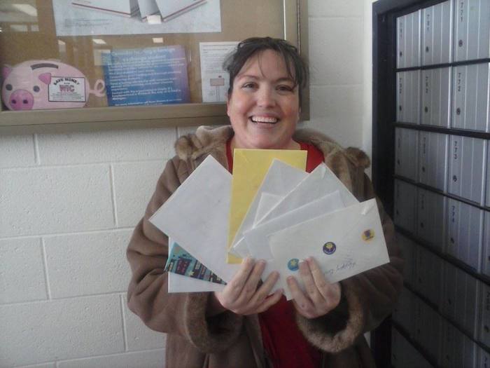 Jennifer Cunningham, Colin's mother, poses with fan mail for her son that she received at a Post Office in in Michigan on Feb. 11, 2014.