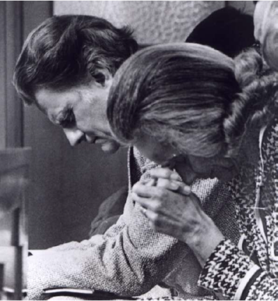 Ruth and Billy Graham praying together.