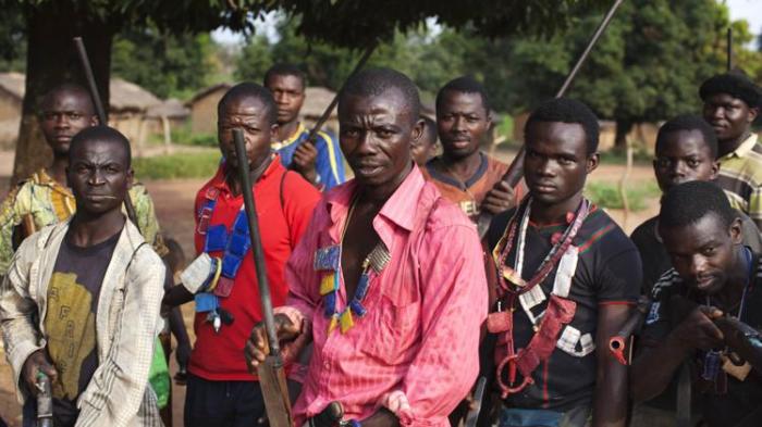 Militia fighters known as anti-balaka pose for a photograph in Mbakate village, Central African Republic on November 25, 2013.