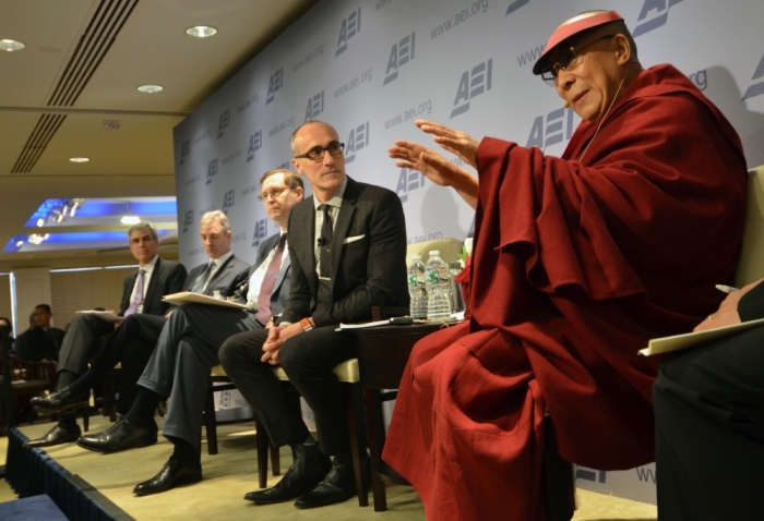 The Dalai Lama, the religious leader of Tibetan Buddhism, speaks at The American Enterprise Institute in Washington, DC on Thursday, February 20. Arthur Brooks, Daniel Loeb, R. Glenn Hubbard, and Jonathan Haidt look on.