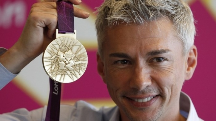 British athlete Jonathan Edwards is an Olympic medalist in the triple jump.