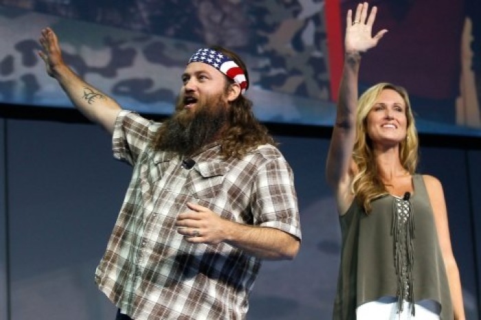 Willie and Korie Robertson of the reality-television show Duck Dynasty speak at the Walmart associates meeting in Fayetteville, Ark., on June 5, 2013.
