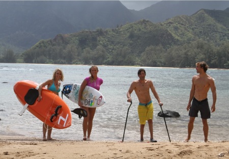 From left to right, Shana Korgan, Bethany Hamilton, Grant Korgan, and Adam Dirks on the beach in Kauai in a scene from "The Current."