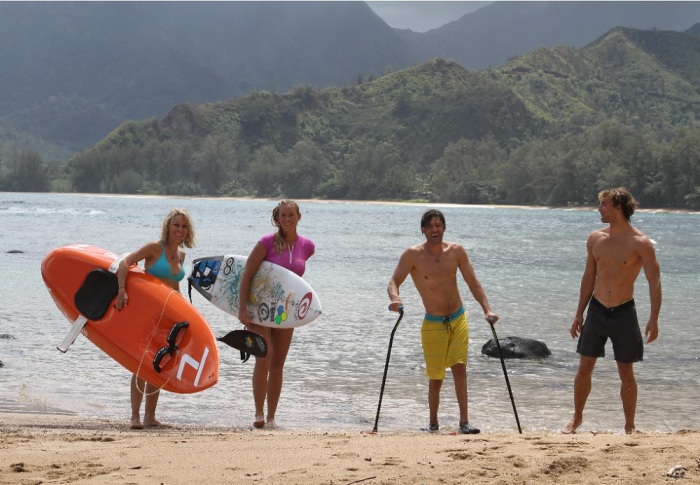 From left to right, Shana Korgan, Bethany Hamilton, Grant Korgan, and Adam Dirks on the beach in Kauai in a scene from 'The Current.'