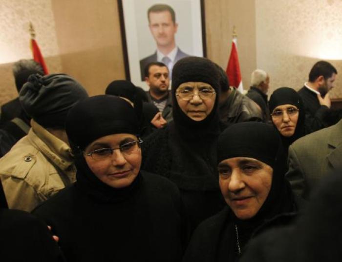 Nuns, who were freed after being held by rebels for over three months, arrive at the Syrian border with Lebanon at the Jdaydeh Yaboos crossing, early March 10, 2014.