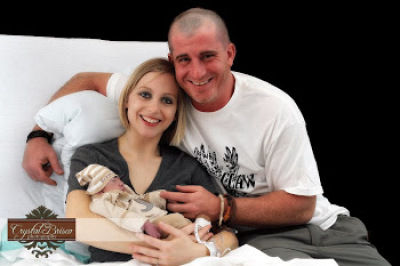 Patrick and Heather Walker cradle their dying son, Grayson James, at a Memphis, Tenn., hospital on Feb. 15, 2012.