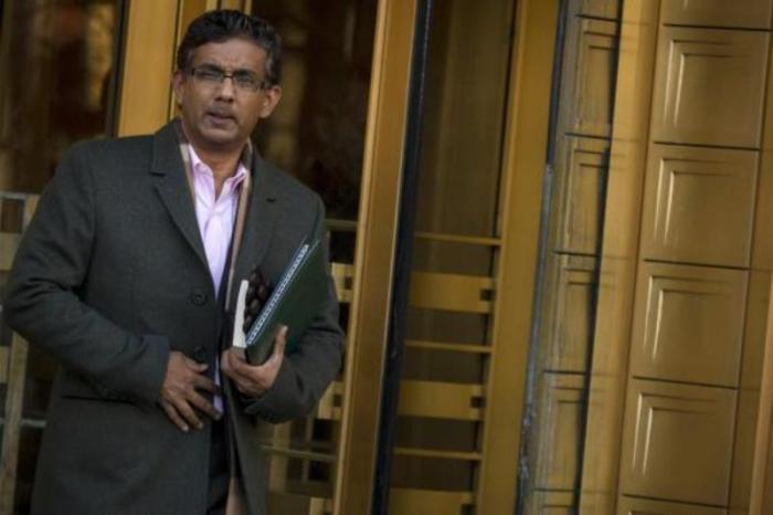 Conservative commentator and best-selling author, Dinesh D'Souza exits the Manhattan Federal Courthouse in New York, Jan. 24, 2014.