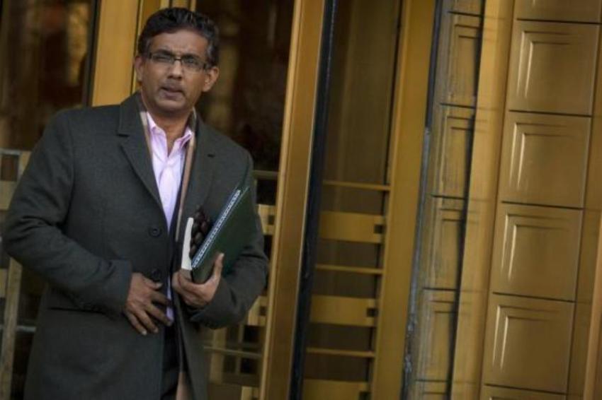 Conservative commentator and best-selling author, Dinesh D'Souza exits the Manhattan Federal Courthouse in New York, Jan. 24, 2014.