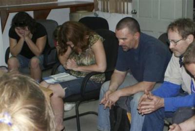 U.S. American missionaries, accused of illegally trying to take children out of Haiti, pray before hearing the verdict from Haitian Deputy Prosecutor Jean Ferge Joseph of the Judicial Police office in Port-Au Prince, Haiti, Feb. 4, 2014.