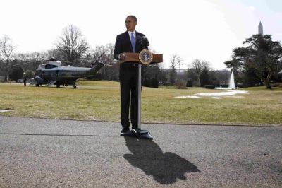 U.S. President Barack Obama talks about Ukraine before boarding Marine One on the South Lawn of the White House in Washington, March 20, 2014.
