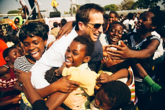 Jedd Medefind in Zambia at OS concert with kids.