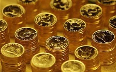 Gold bullion coins known as Krugerrands are pictured in the mint where they are manufactured in Midrand outside Johannesburg October 3, 2008.