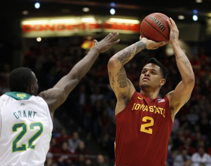Iowa State Cyclones guard Chris Babb (R) shoots over Notre Dame Fighting Irish guard Jerian Grant during the first half of their second round NCAA tournament basketball game in Dayton, Ohio March 22, 2013.