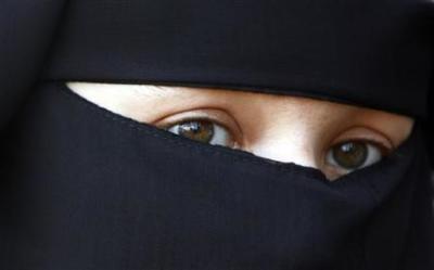 A protestor attends a demonstration against the ban on Muslim women wearing the burqa in public in The Hague, November 30, 2006.