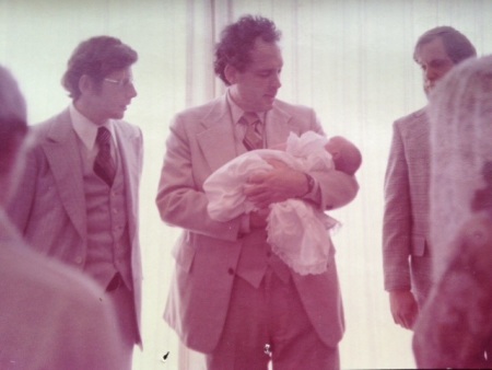 Elizabeth Esther: "This is the day I was "dedicated" to God during our Sunday Morning Worship service in The Assembly. My grandfather, George Geftakys, is holding me. My Dad is to his right. I am 3-months old."