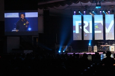 Spoken word artist Propaganda speaking at the Saturday morning session of Reverse, a youth event organized by Dare 2 Share Ministries on the last weekend of March 2014, held at the Hylton Memorial Chapel in Woodbridge, Virginia.