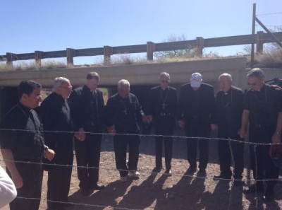 Members of the United States Conference of Catholic Bishops gather for prayer at the U.S.- Mexican border.