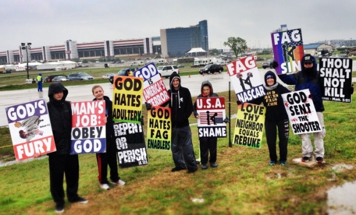 Members of Westboro Baptist Church in Topeka, Kan., protest the Duck Commander 500 at Texas Motor Speedway in Fort Worth, Texas, April 6, 2014.