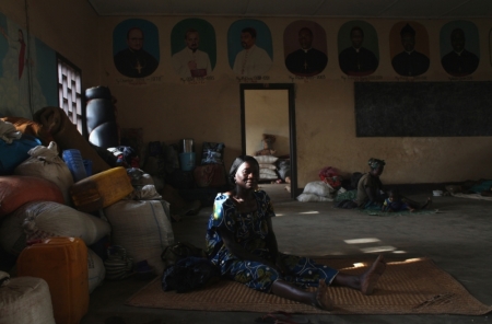 A woman displaced as a result of religious violence rests in a house within the Catholic Church in Bossangao, north Bangui, in this January 2014 report.