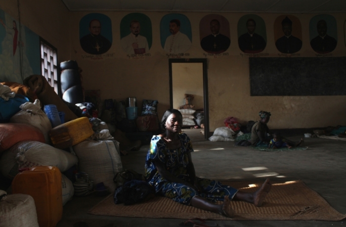 A woman displaced as a result of religious violence rests in a house within the Catholic Church in Bossangao, north Bangui, in this January 2014 report.