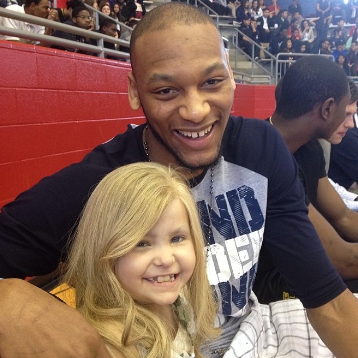 Lacey Holsworth and Michigan state star forward Adreian Payne